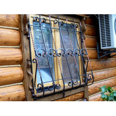 Ковані ґрати на дерев'яний будинок